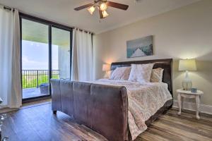 a bedroom with a bed with a view of the ocean at Dauphin Island Condo with Pool, Balcony and Ocean View in Dauphin Island +21 photos