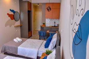 En eller flere senge i et værelse på Good Times Luxury Apartments Bitola