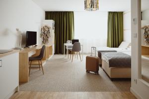 Telewizja i/lub zestaw kina domowego w obiekcie Arche Hotel Poloneza
