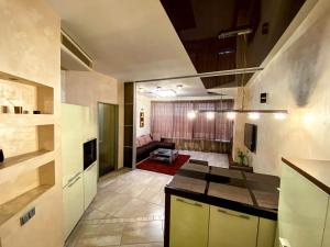 a room with a kitchen and a living room at Apartment-Hotel Panorama in Dnipro