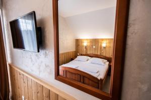 Uma cama ou camas num quarto em Hotel Enigma