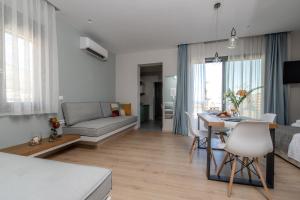 Postel nebo postele na pokoji v ubytování Melcon Luxury Suites