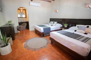 Postel nebo postele na pokoji v ubytování Hotel Macondo Holbox