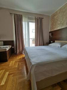 Postel nebo postele na pokoji v ubytování Villa Salvia