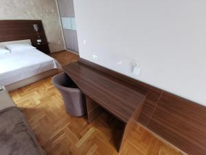 a hotel room with a bed and a sink at Villa Salvia in Mostar