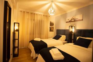 Llit o llits en una habitació de Meriteluna Pateo - Entre Lisboa, Sintra e Cascais