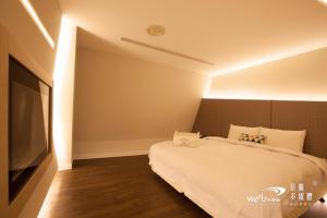 Voodi või voodid majutusasutuse Ya Nold Hot Spring Hotel toas