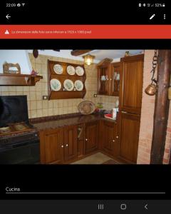 Kuchyň nebo kuchyňský kout v ubytování Domus La Pineta