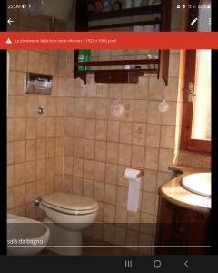 Koupelna v ubytování Domus La Pineta