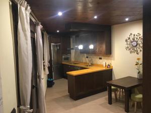 Kuchyň nebo kuchyňský kout v ubytování Hostal Mulhacen