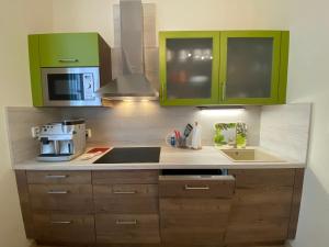 Kuchyň nebo kuchyňský kout v ubytování ML Apartment