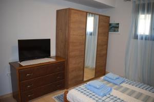 A bed or beds in a room at Villa Thetis with private pool where the sunsets fade away
