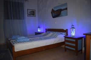 A bed or beds in a room at Villa Thetis with private pool where the sunsets fade away