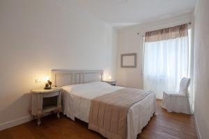 מיטה או מיטות בחדר ב-La mia casa a Levante