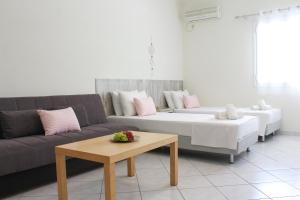 Postel nebo postele na pokoji v ubytování Iason Apartments