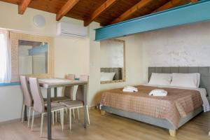 מיטה או מיטות בחדר ב-3D iliadis Suites