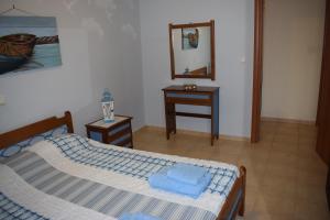 A bed or beds in a room at Villa Thetis with private pool where the sunsets fade away