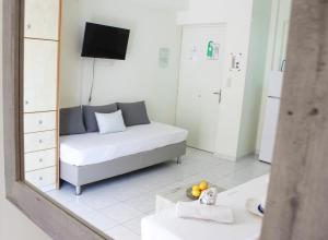 Postel nebo postele na pokoji v ubytování Iason Apartments