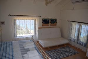 A bed or beds in a room at Villa Thetis with private pool where the sunsets fade away Még 37 kép