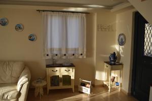 A seating area at Villa Thetis with private pool where the sunsets fade away