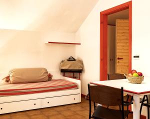 A bed or beds in a room at Aparthotel Claviere