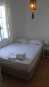 Postel nebo postele na pokoji v ubytování Sunset hotel