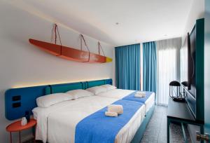 Postel nebo postele na pokoji v ubytování Hotel Albatros