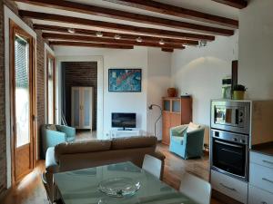 a living room with a couch and a table at OLYMPIC VILLAGE in Barcelona