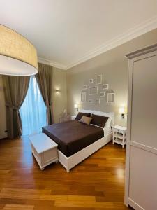 Katil atau katil-katil dalam bilik di L’Arco Bed&Breakfast