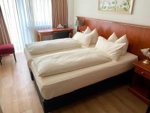 Cama ou camas em um quarto em Hotel Condor