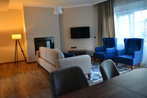 TV a/nebo společenská místnost v ubytování Kemer Babel Residence
