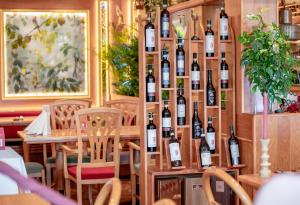 a room filled with lots of bottles of wine at Hotel San Marco in Füssen