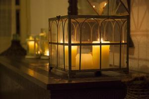 a lantern filled with candles on a table at Elpida Village in Istro