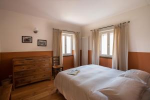 Postel nebo postele na pokoji v ubytování La Collina delle Mignole