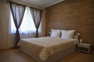 Postel nebo postele na pokoji v ubytování Guest House ERIDA + 37 fotografií