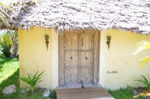 Um jardim em Qambani Luxury Resort