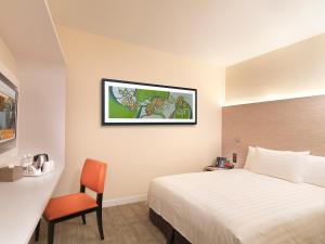 A bed or beds in a room at Sama Sama Express klia2 (Airside Transit Hotel)