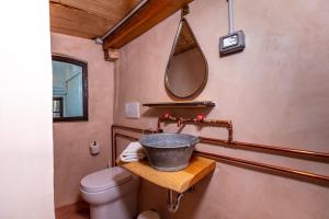 a bathroom with a sink and a toilet at NATURA rooms&sport in Finale Ligure +74 photos