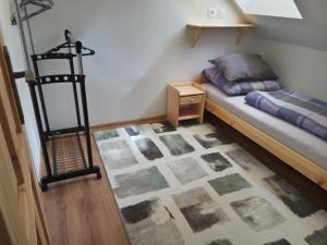 A bed or beds in a room at Žrebčín Mlynčok