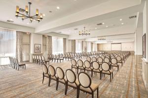 a room with rows of chairs in a room with a stage at Westward Look Wyndham Grand Resort & Spa in Tucson