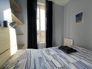 Кровать или кровати в номере Chez Emile - Sole' Île - T3 superbe - avec vue
