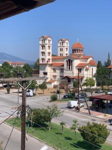 a view of a town with tall white buildings at Hotel Platon in Nei Poroi