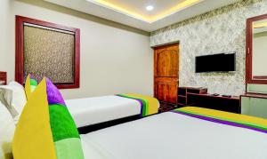 TV o dispositivi per l'intrattenimento presso Itsy Hotels Aasma Luxury Villa