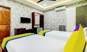 TV o dispositivi per l'intrattenimento presso Itsy Hotels Aasma Luxury Villa