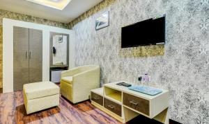 TV o dispositivi per l'intrattenimento presso Itsy Hotels Aasma Luxury Villa