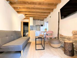 a living room with a couch and a table at VUT Domus Aurea in Astorga +23 photos