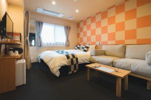 TV a/nebo společenská místnost v ubytování Kyoto Earth Hotel