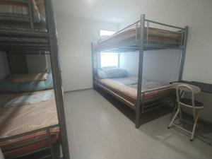 Voodi või voodid majutusasutuse Simple Stay Miyajima toas