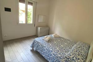 A bed or beds in a room at M.G Home a un passo da tutto