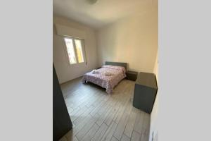 A bed or beds in a room at M.G Home a un passo da tutto